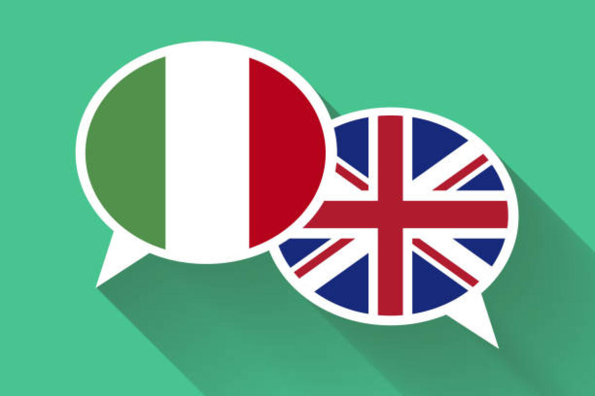 A Londra si parla di nuovo Italiano - Two white speech bubbles with Italian and Great britain flags. English language conceptual illustration